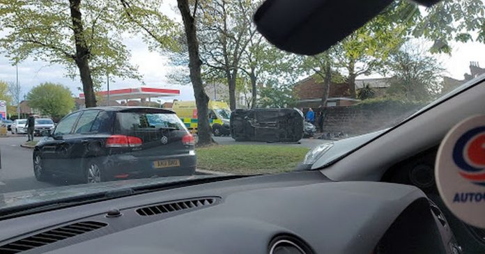 Live updates when Queens Drive was closed by police after the car tipped on its side in an accident

