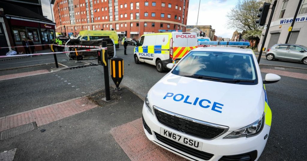 Car on the side of a cordoned off road after a serious accident in