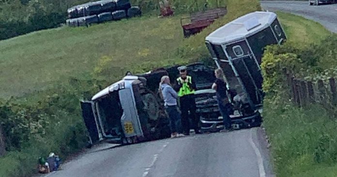 Photos show the scene of a collision in Cadbury near Tiverton, involving a 4X4 and what appears to be a car towing a horse box.