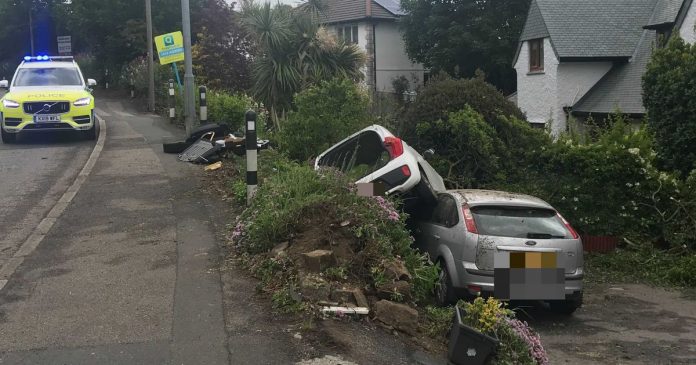 Car crashes into the garden and lands on another vehicle on the A39 in Truro - live updates

