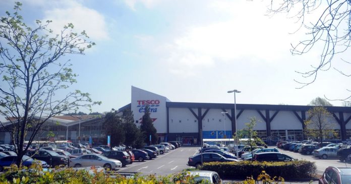 The driver ran over a man's leg in Tesco's parking lot after being labeled 