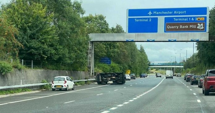 Car tips on its side on the M56 near Manchester Airport

