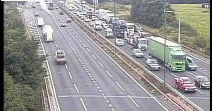 M4 truck and car crash results in seven mile long queues - live updates

