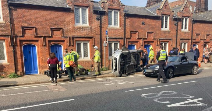 Police issue update after overturned car blocks Bedford Street

