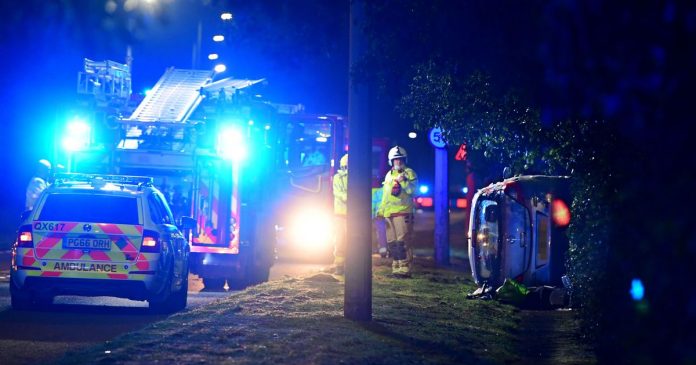 Car tilts on its side and road locked after accident

