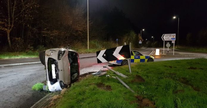  Notable police photo shows a car after an accident in Bridgend.  was left on the side of a roundabout

