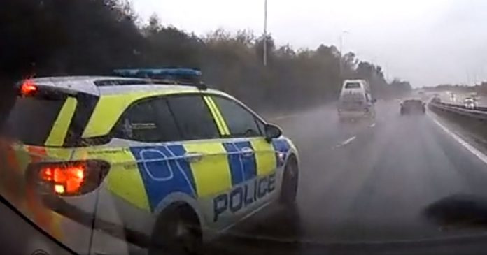 Dashcam video shows a police car almost 