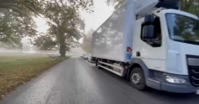 The shocking video shows a 90-car line of 