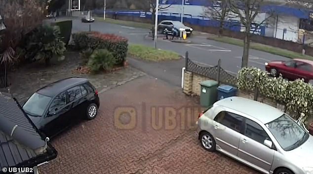A mother and her two children cross the street before being hit by the speeding car