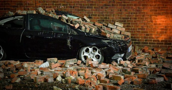 Parked car left crushed after Storm Dudley blows bricks off house in Salford
