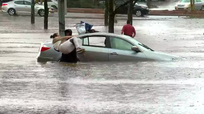 WBRC FOX6 News photographer helps woman get out of her flooded car
