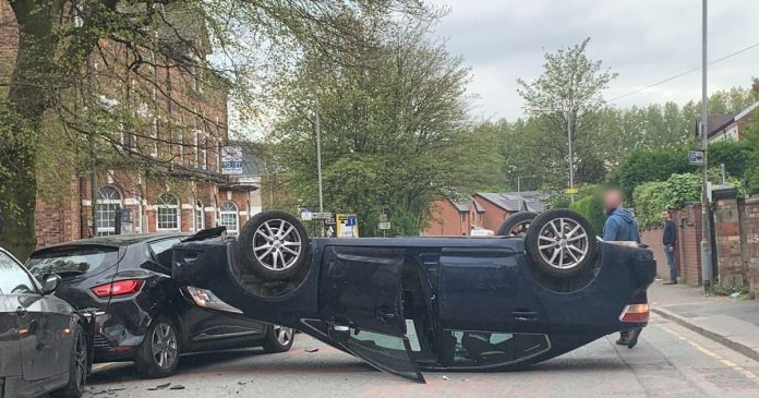 Moment car flips over in middle of quiet Prestwich street after three car collision
