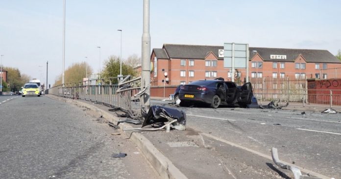 Four taken to hospital after two-car crash shuts major road for hours
