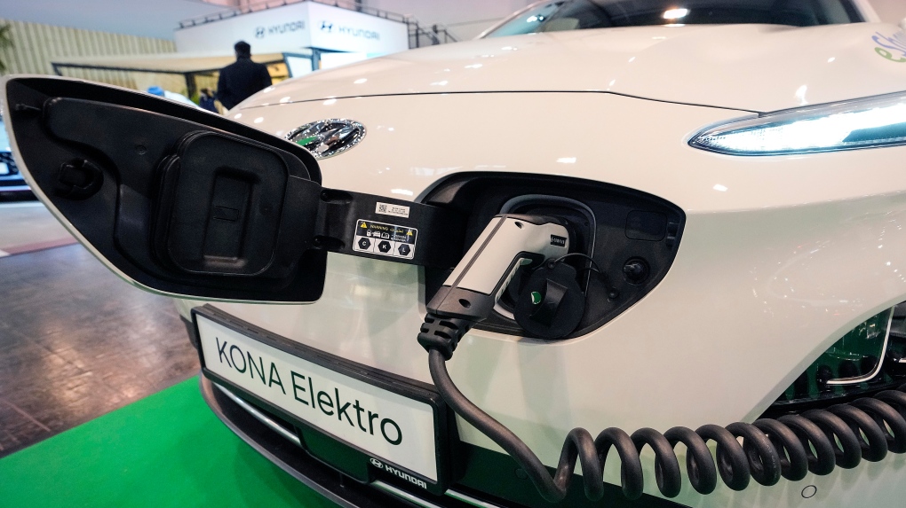 A Hyundai Kona electric car is charged at the Motor Show in Essen, Germany, Dec. 2, 2021. (AP Photo/Martin Meissner) 