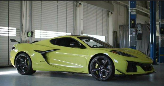 2023 C8 Chevrolet Corvette Z06 yellow front side view parked in garage
